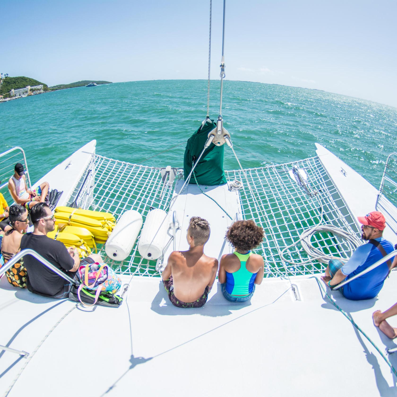 people hanging out on the sailing catamaran