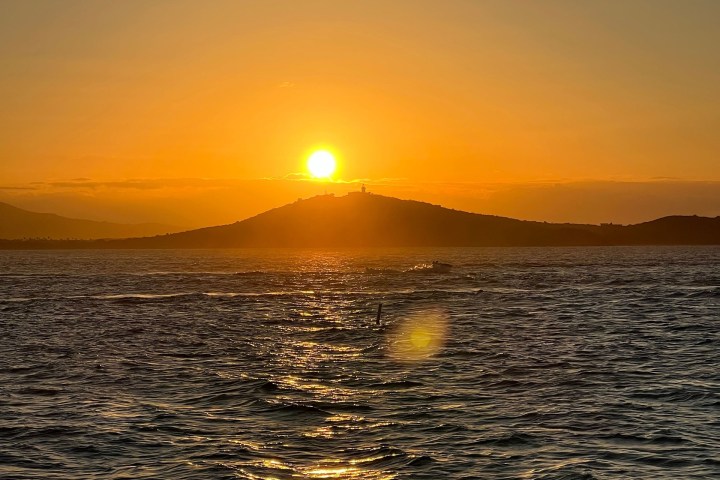 a sunset over a body of water
